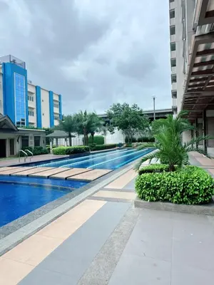 a swimming pool in the middle of a building at Place to stay in pasay near Airport in Manila