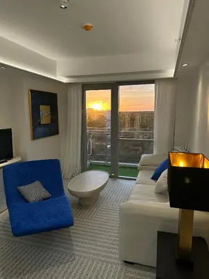a hotel room with two beds and a large window at Modern Boutique Spacious Apartment Near Airport OKADA SOLAIRE MOA in Manila