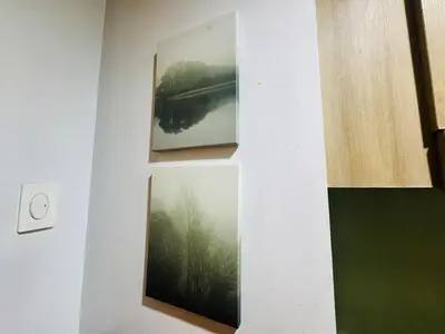 two framed photographs on a wall in a room at Shore Residences 2 Beds Forest Green RM 630 by Prime Stay in Manila