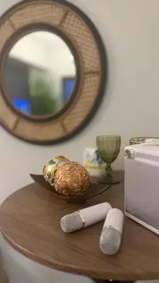 a table with a plate of food and a mirror at Relax in Comfort at Shore 2 Residences Mall of Asia-Pasay in Manila