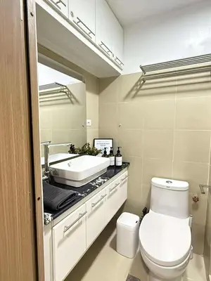 a bathroom with a white toilet and a sink at Condo in Shore 3 Residences, Pasay in Manila