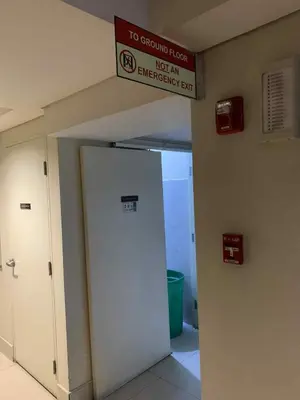 a sign above a door in an emergency room at Shell Residence MOA Pasay by Kathy in Manila