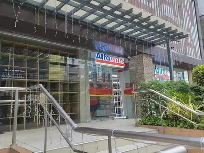 a store front with an aico market sign in front at Erro Place Wi-Fi 200mbps & Netflix in Manila