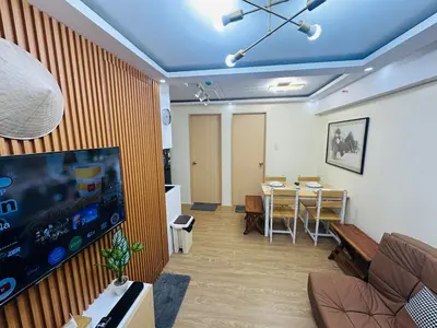 a room with a living room with a dining room at 17th Casa Horizon in Manila