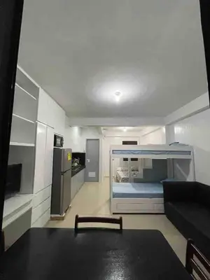 a living room with a couch and a bed at Big Beautiful House in Pasig in Manila