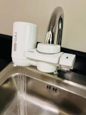 a coffee cup sitting on top of a sink at Sarah's Place at Light Residences in Manila