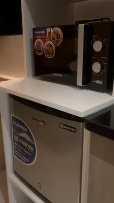 a microwave oven sitting on top of a counter at CitySoul in Manila