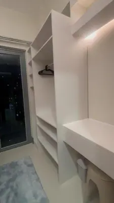 a white room with a window and a shelf at CitySoul in Manila