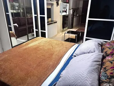 a bedroom with a bed and a television in it at Yare Pasay City Apartment for Rent Perfect for Stay front of Mall of Asia in Manila