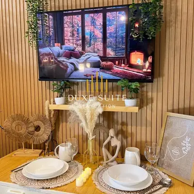 a table with plates and candles on top of it at Staycation in RLX in Manila