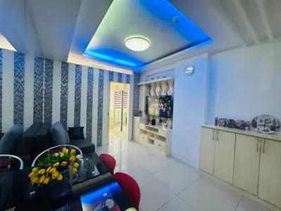 a living room with a blue ceiling at Xenial Pasay City Apartment for Rent - Entire House Front of Mall of Asia in Manila