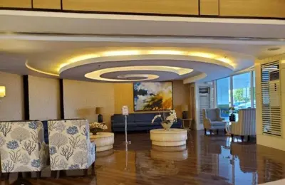 a lobby with a waiting room with a couch and chairs at Dainty Pasay City Apartment for Rent - Entire House Front of Mall of Asia in Manila