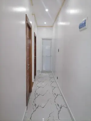 a hallway with a marble floor in a room at Navio Transient House in Cabuyao