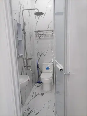 a bathroom with a toilet and a sink at Navio Transient House in Cabuyao