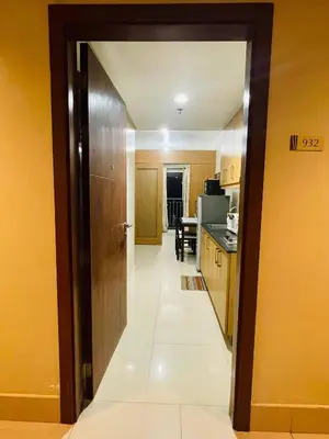 a hallway of a kitchen with a door open at Fancy Pasay City Apartment for Rent - Mall of Asia Nearby front of Mall Of Asia in Manila