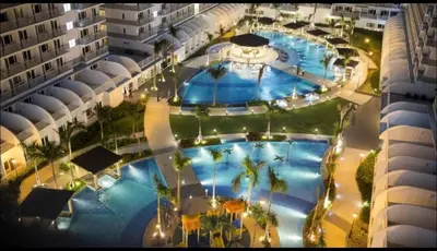 an overhead view of a large swimming pool in a building at Joyful Pasay Getaway Staycation Condo Near MOA and IKEA near Mall of Asia in Manila