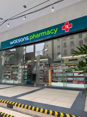 a store with a pharmacy sign on the front of it at Kai cabins WALKING DISTANCE NAIA 3 AIRPORT NEWPORT CITY in Manila