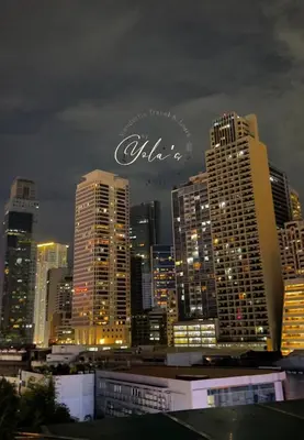 a view of a city skyline at night at Yola's Staycation - Jazz Residences Makati City in Manila