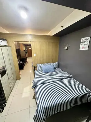 two beds are lined up in a room at Shell Residence Pasay MOA with 2 Beds by G&K in Manila