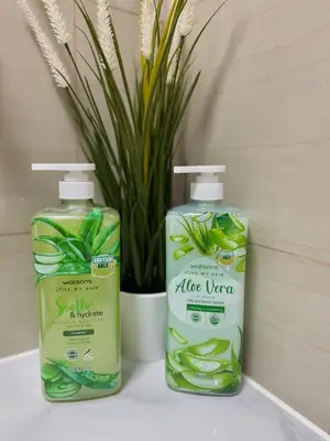 two bottles of rice vinegar sitting next to a plant at Le Luna Unit - Affordable Staycation near Airport & MOA with pool by Voyage Vista - Azure & Shore Staycation in Manila