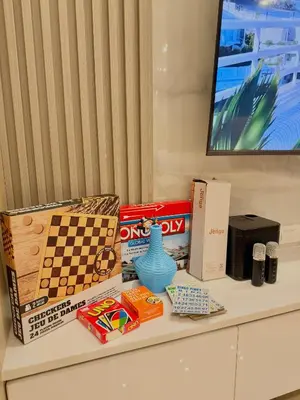 a table with toys and games on it at Le Luna Unit - Affordable Staycation near Airport & MOA with pool by Voyage Vista - Azure & Shore Staycation in Manila