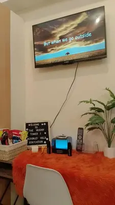 a flat screen tv hanging on a wall at McKinley Hills Taguig Haven in Manila
