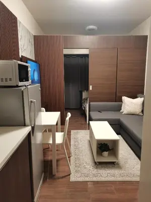 a living room with a couch and a table at 