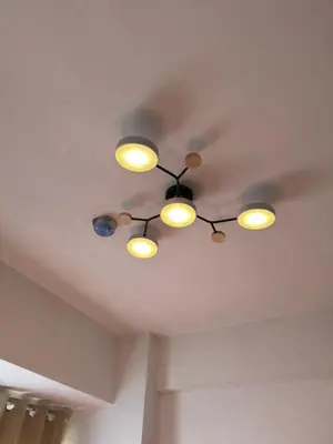 a row of lights on a ceiling at PaulBert's Cabins II in Sampong