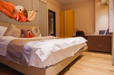 a bedroom with a large bed in a room at Luxury Condo at Bayshore Residential Phase 2 beside OKADA & near MOA in Manila