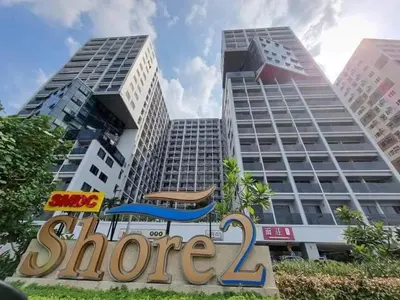 a store sign in front of two tall buildings at Perfect Sunset View in Pasay Near MOA & NAIA in Manila