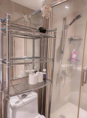 a bathroom with a white toilet and a shower at Elegant Stylish 1 Bedroom Balcony City and Manila Bay view FREE Sauna Pool GYM Makati in Manila