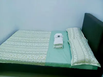 a bed with a blanket and a bottle on it at Seren View Bedspace - S Residences in Manila
