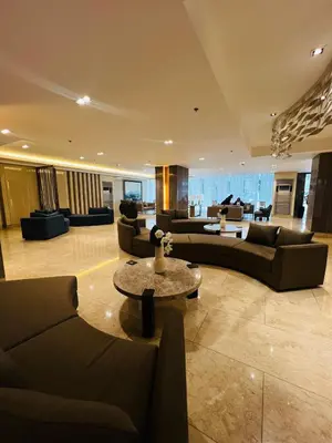 a large living room with couches and a table at MOA GRAND STAY Suite08 Newly Turn-over Only! in Manila