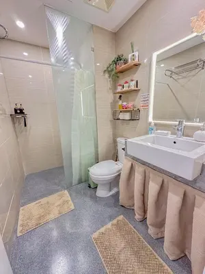 a bathroom with a tub and a toilet and a sink at nJoy! Elegant Peach Heaven at Venice Grand Canal in Manila