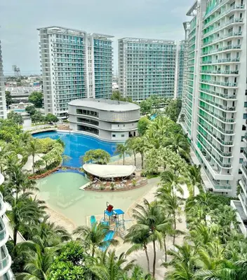 an aerial view of a resort with a pool and palm trees at Premium Unit in Maldives in Manila