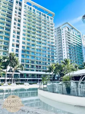 a view of a resort with palm trees and buildings at Condotels RQ Hob in Manila