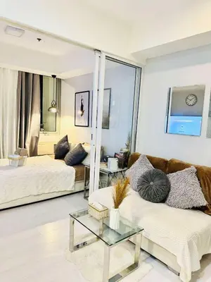 a living room with a couch and a table at Condotels RQ Hob in Manila