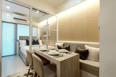 a room with a dining table and a bed at Hotel Comfort FREE Parking Fame Mall Access in Manila
