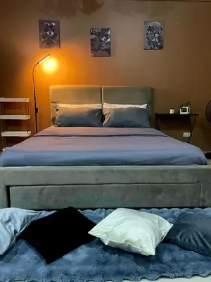 a bedroom with a large bed with two pillows at XYz's Condo - Walk To MNL T3 via Runway Manila in Manila