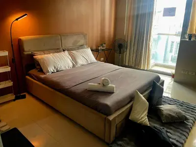 a bedroom with a bed with a tray on it at XYz's Condo - Walk To MNL T3 via Runway Manila in Manila