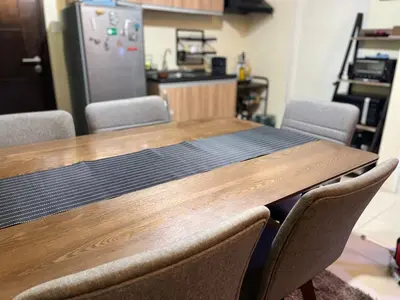 a kitchen with a wooden table with chairs around it at Staycation and WFH with Netflix and Pool for up to 4 guests in Manila