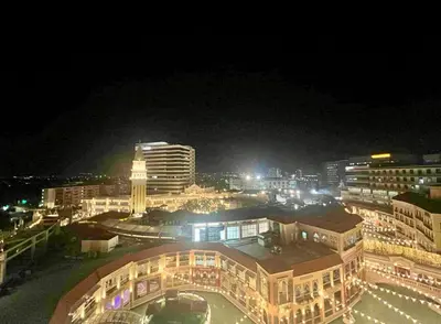 a view of a city at night with lights at Jazzy Flat in Manila