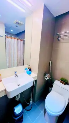 a bathroom with a white sink and a toilet at Hotel hotel in Manila