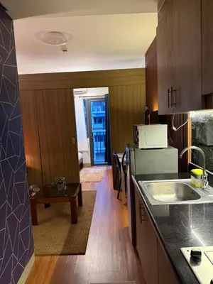 a kitchen with a sink and a counter top at S&B rentals in Manila