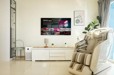 a white room with a chair and a desk at Elegant 3 Bedroom unit with Ocean View near Okada in Manila