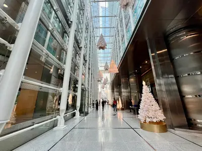 a christmas tree in the middle of a shopping mall at Mandala Stays - The Family Suite in Manila