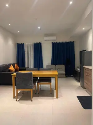 a living room with a table and a couch at Condotels by Tribecca Private in Manila