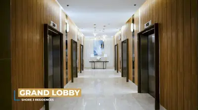 a hallway of a building with wooden walls and a table at SM MOA Near NAIA Airports 1 Bedroom with balcony SG Suite 2 at Shore 3 in Manila
