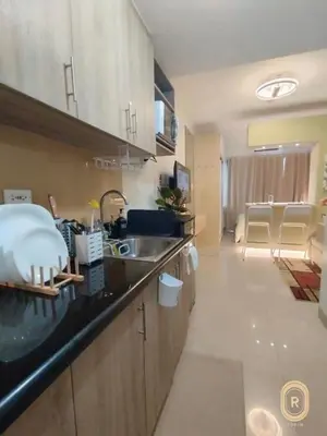a kitchen with a sink and a counter top at R Cabin - Shore Residences in Manila