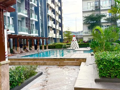 a swimming pool in the middle of a building at Unit 2H 81 Newport Boulevard Condominium Perfect for Layovers Across NAIA Terminal 3 in Manila